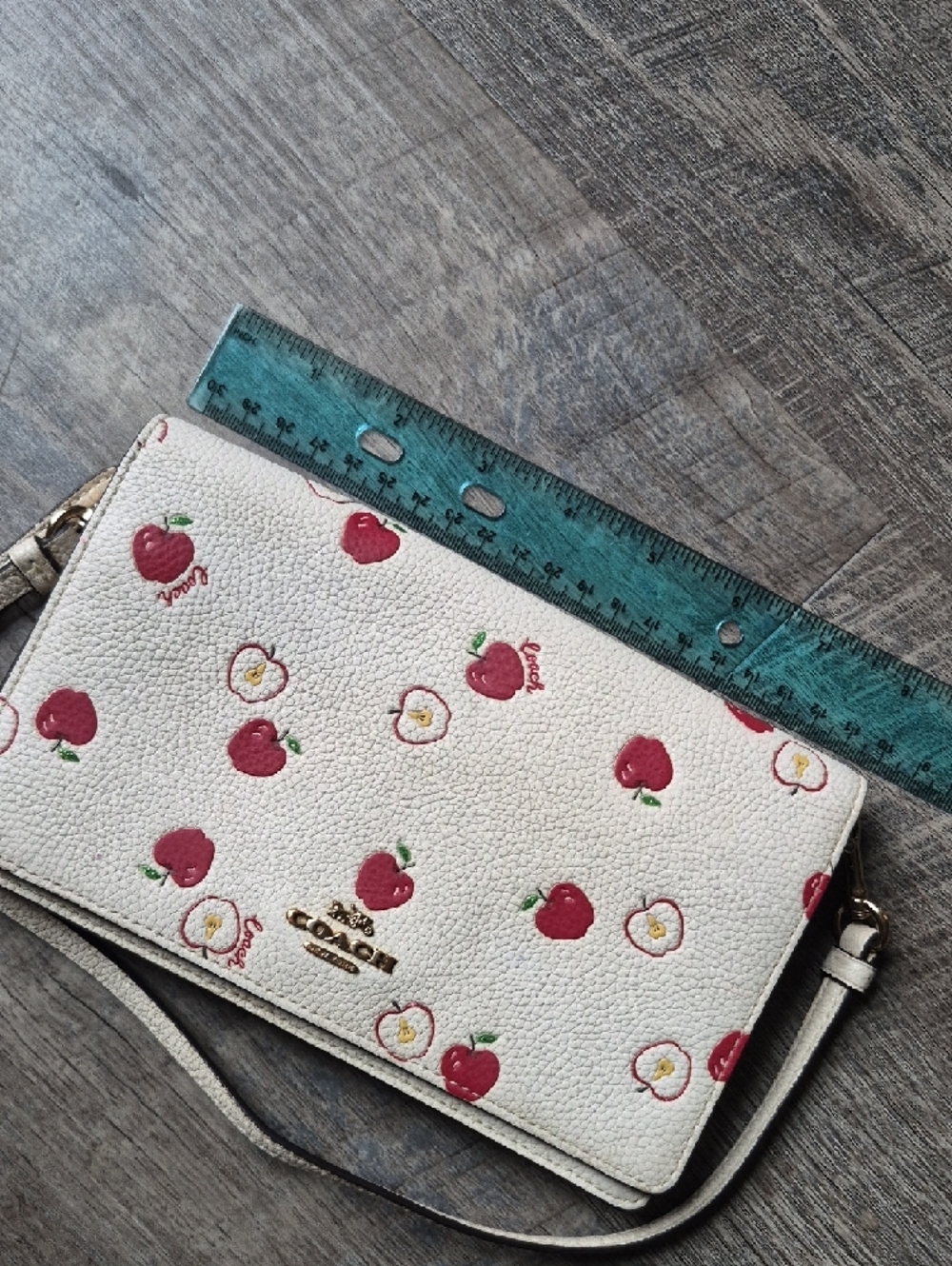 Coach Anna Foldover Clutch Crossbody Bag in a white color with a red apple print - Picture 13 of 16